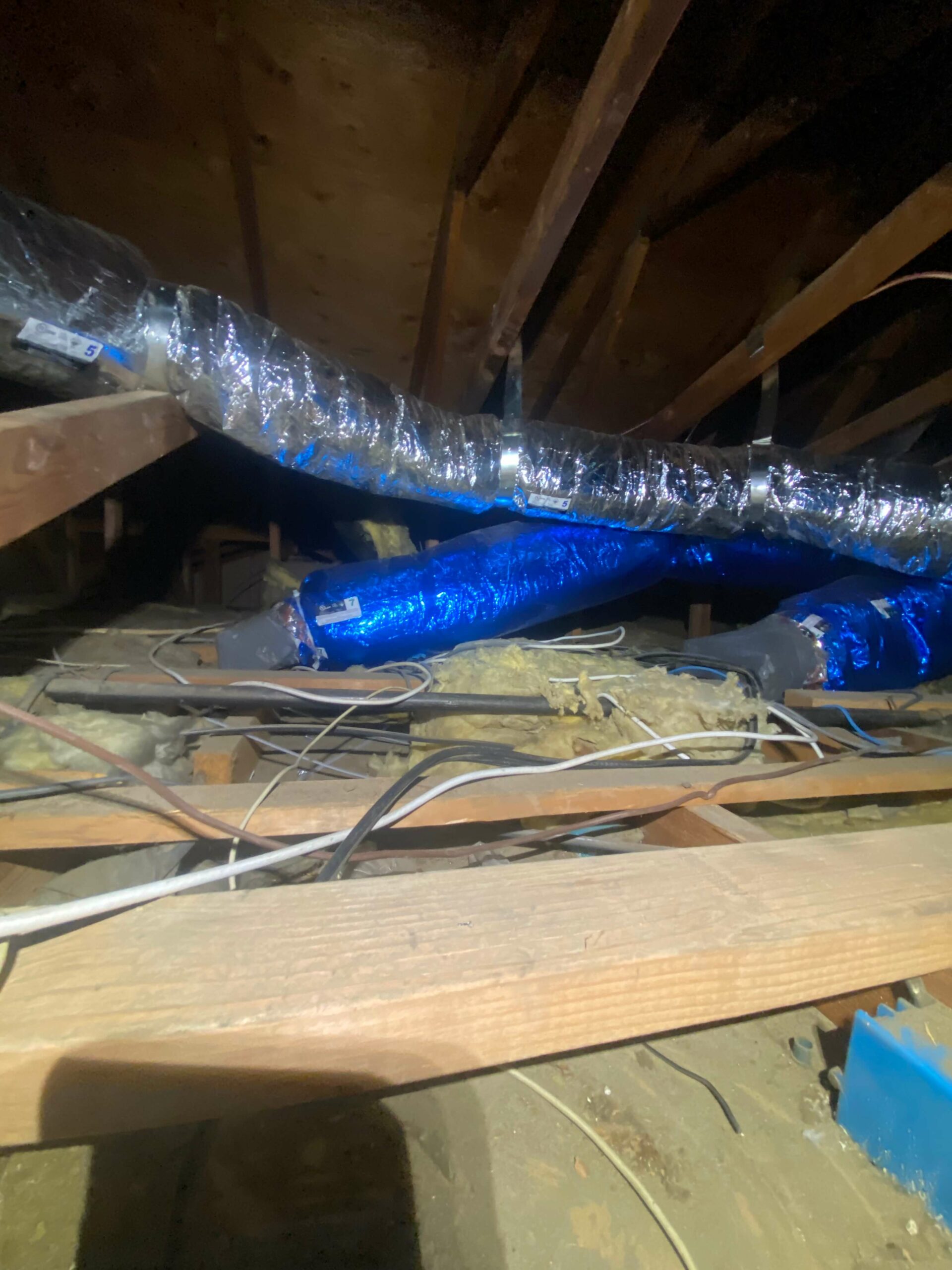 blue and silver ducts in attic